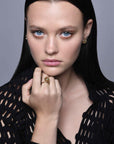 model wearing Jaipur gold ring in 18kt with sculptural sphere design, handcrafted Italian fine jewellery