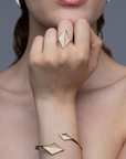 Model wearing the Rekhale gold diamond ring, architectural Italian luxury jewellery