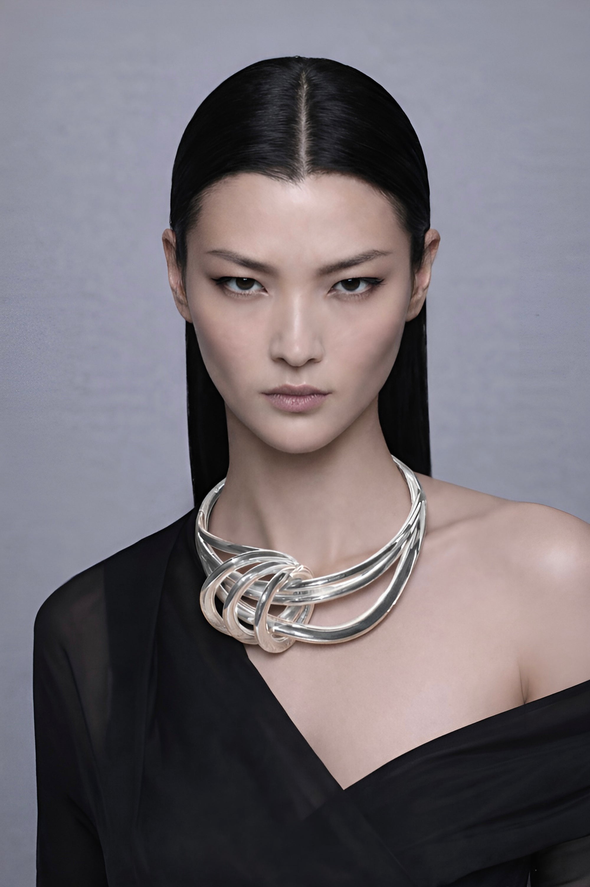 model wearing aurora sculptural knot detail, handcrafted sterling silver necklace