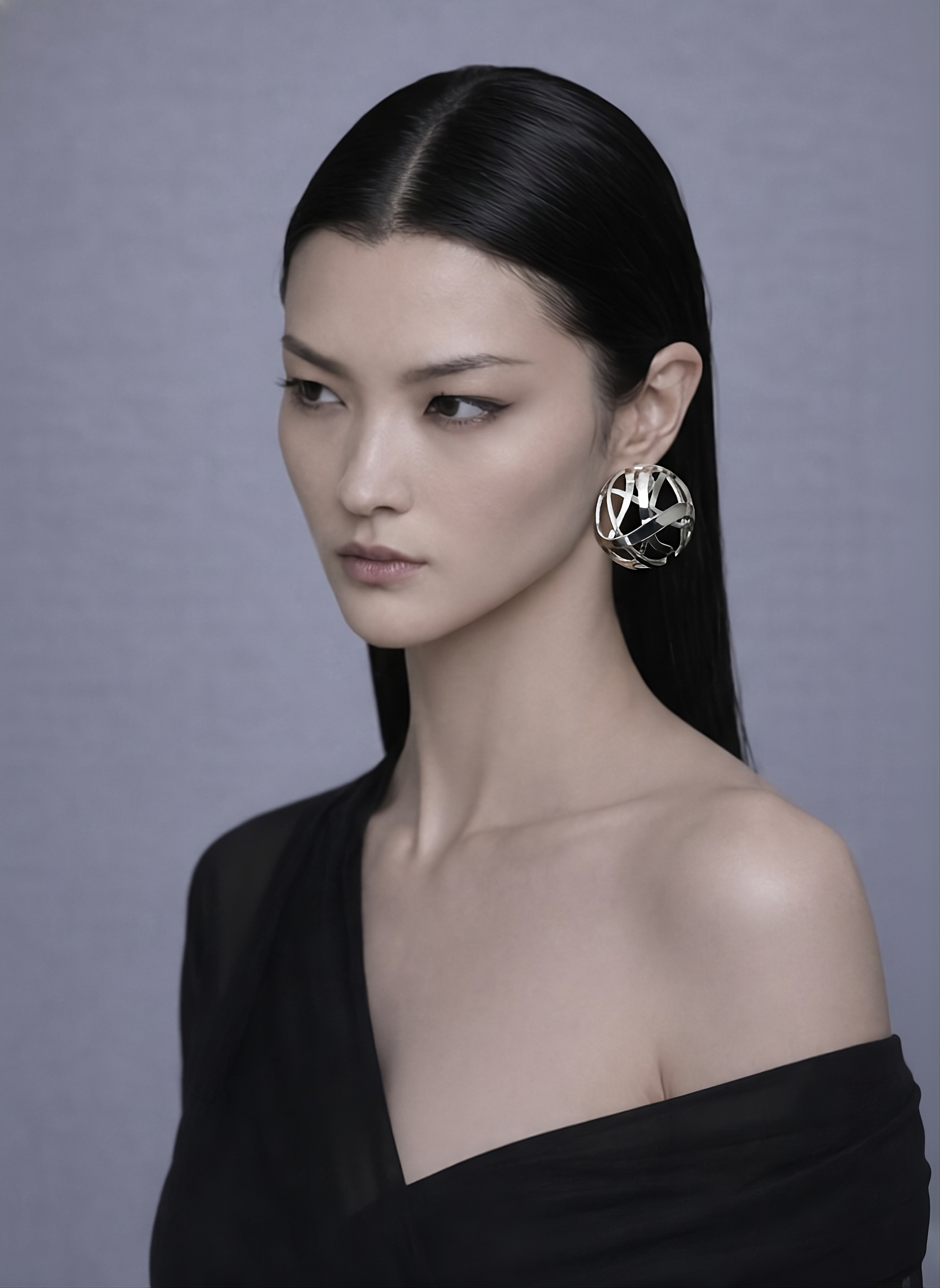 model wearing Elva earrings in Sterling Silver 925, sculptural statement design