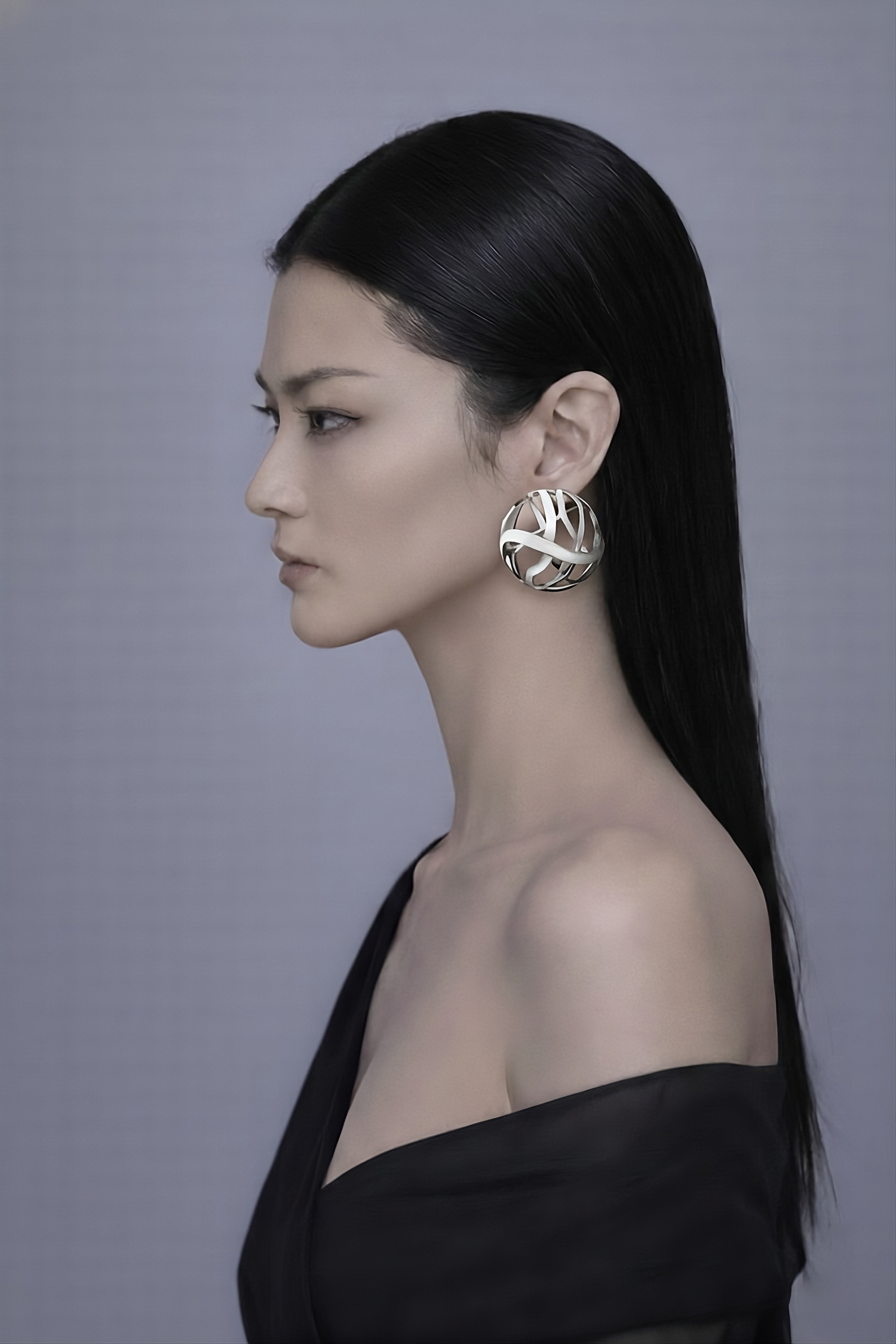 model wearing Architectural enamel earrings handcrafted in italy, designer jewelry