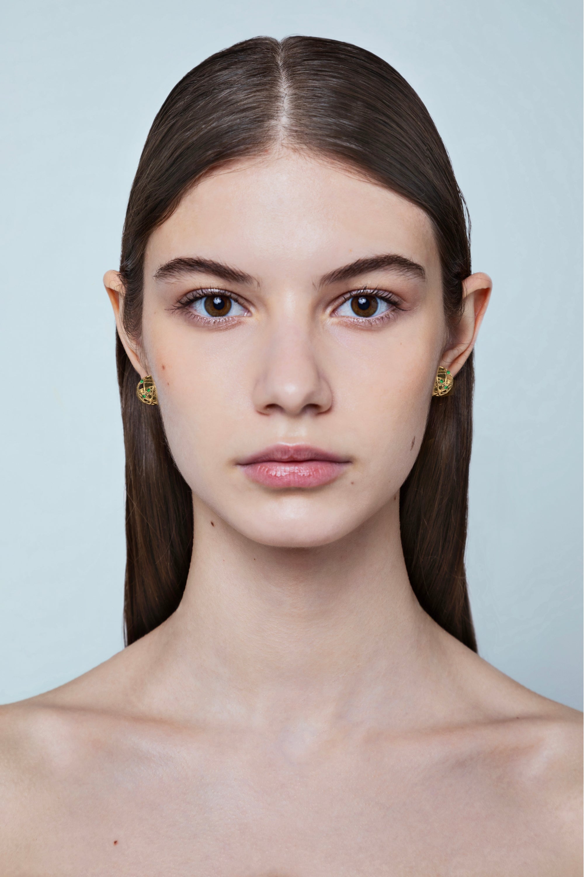 model wearing Jaipur Emeralds gold earrings in 18kt with sculptural spherical design, handcrafted Italian fine jewellery